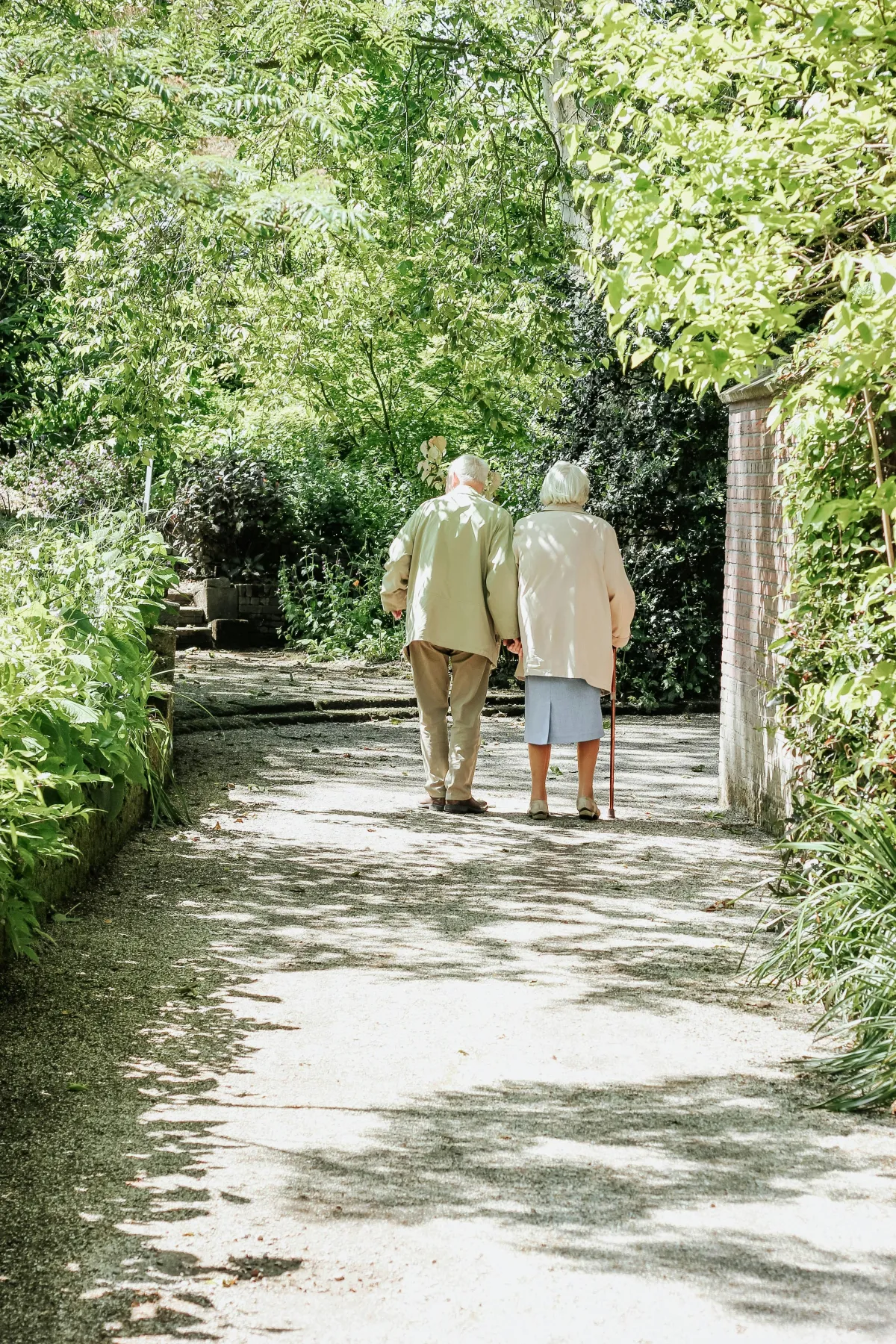 Senior couple walking holding hands having peace of mind that their affairs are in order for their loved ones.