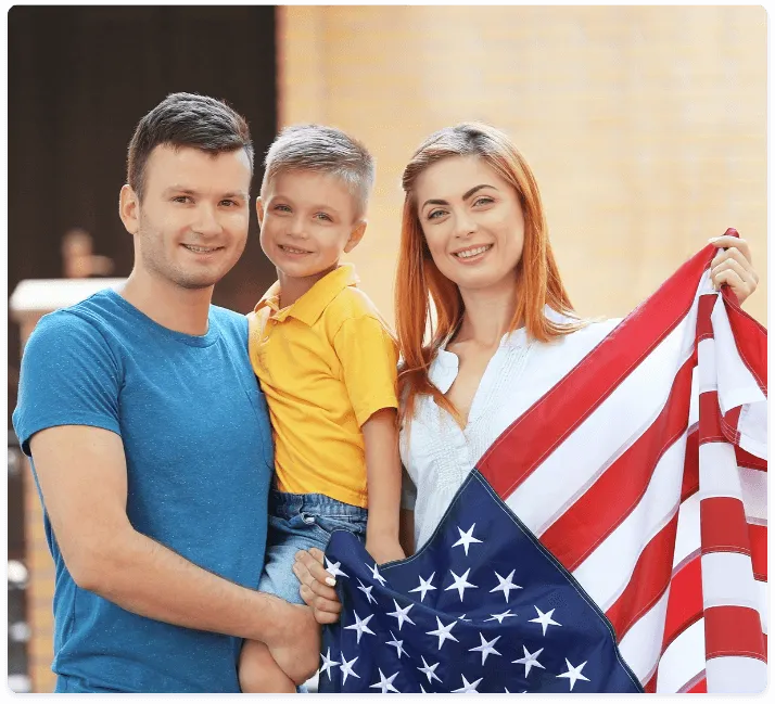 Young family with one child holding the American flag, symbolizing family values, health, and ACA coverage for all Americans.