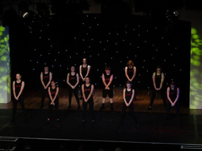 Street Kix teens performing a bold group routine at the 2024 MGA show, showcasing street dance style and team energy.