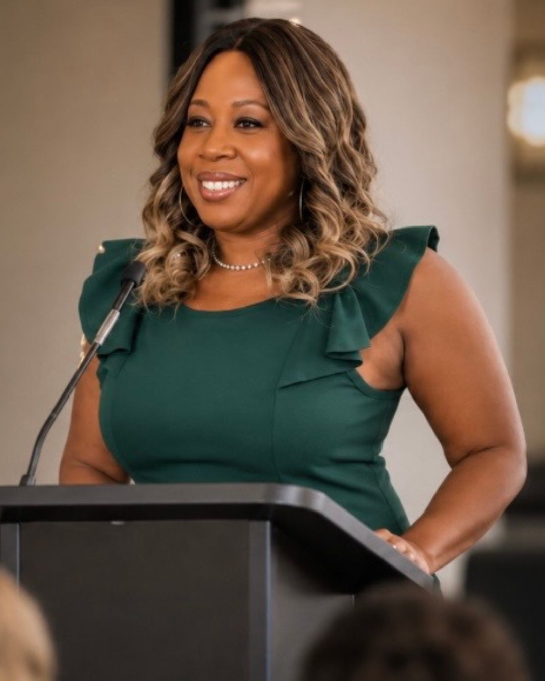 Erika speaking passionately at a conference