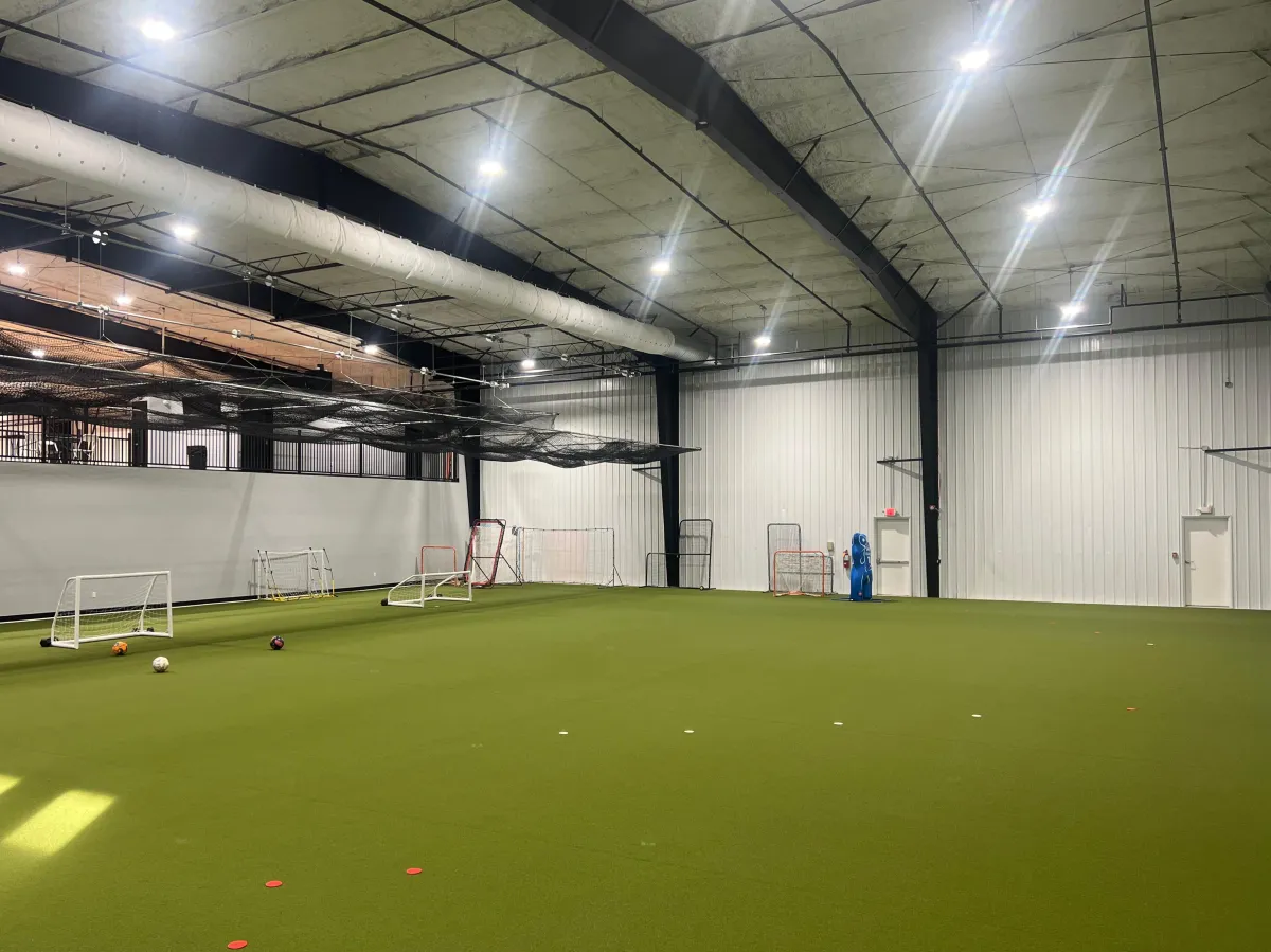 a basketball court with a blue and red court
