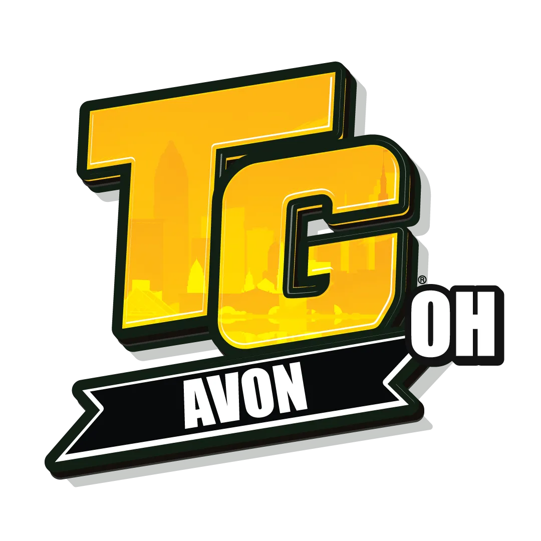 Top Gun Training Center logo featuring "TG" in yellow with "AVON OH" below, representing gymnastics and cheerleading programs.