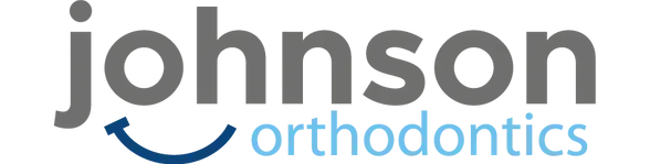 Johnson Orthodontics logo featuring stylized text in gray and blue, representing a local business supporting Top Gun Ohio gymnastics and cheerleading training.