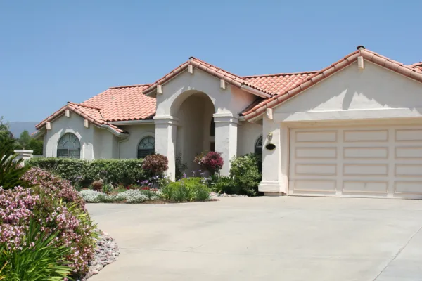 Stucco painting a house in Western Colorado