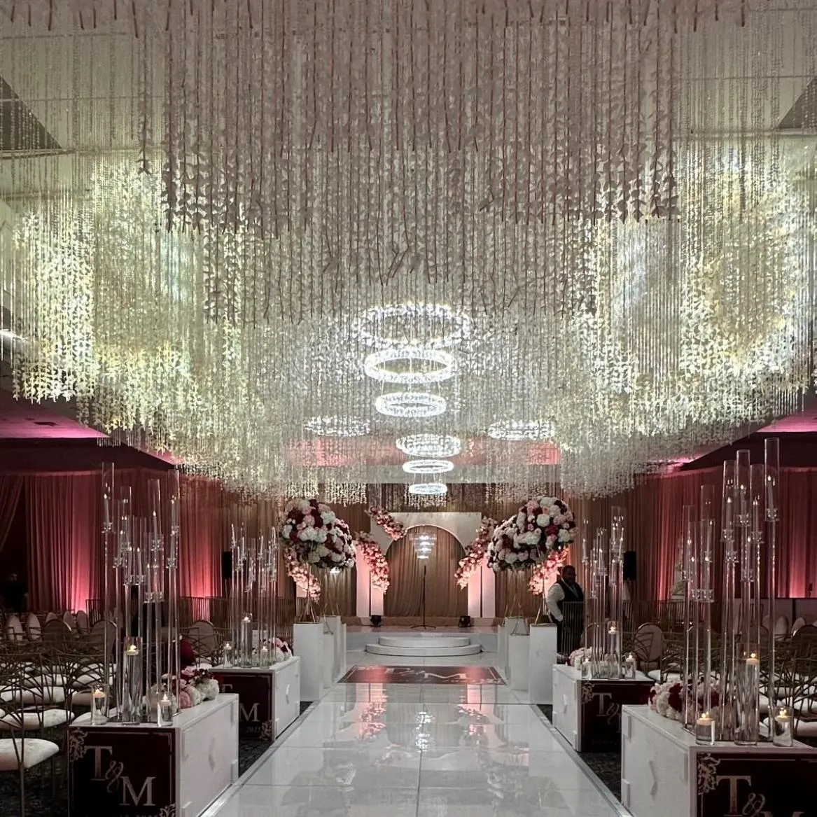 Luxury ceiling draping rental in Detroit ballroom with soft ivory fabric and warm uplighting