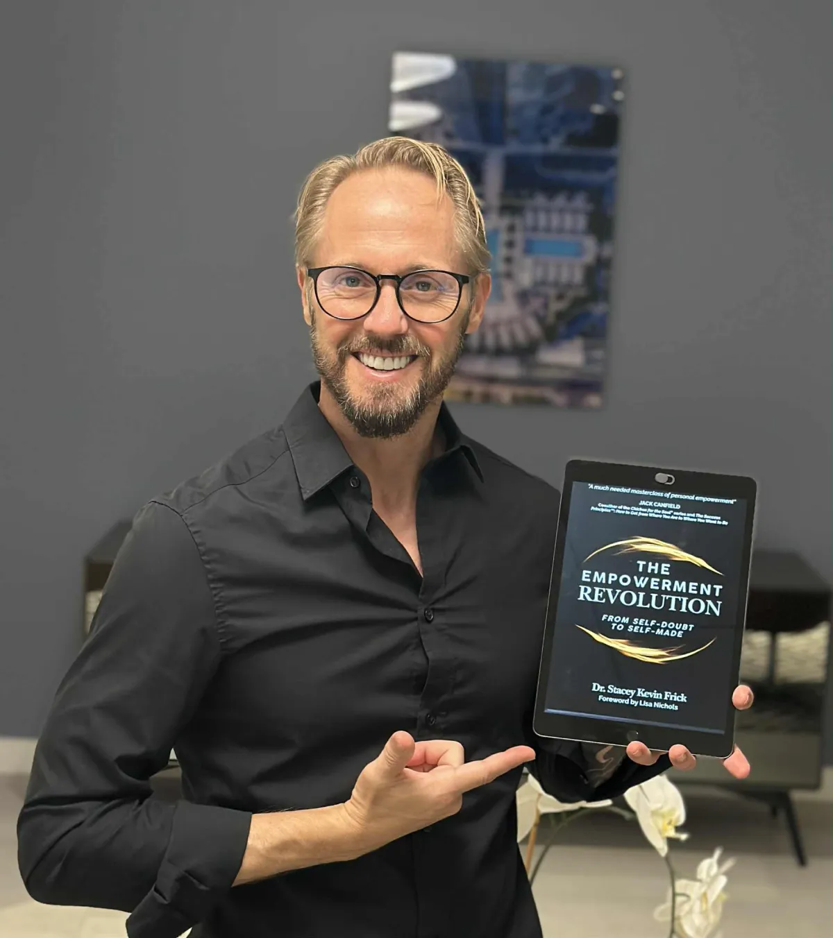 Dr. Stacey Kevin Frick with his book the Empowerment Revolution