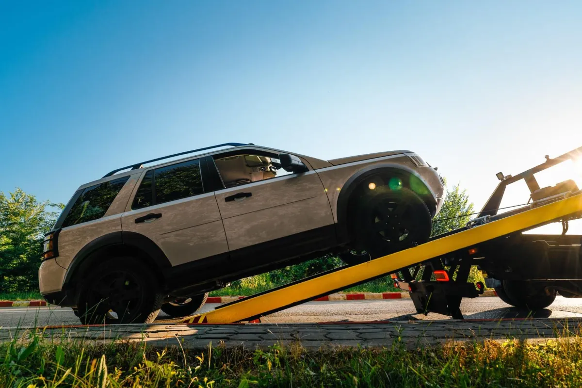 tow truck towing a car in Pompano Beach, FL