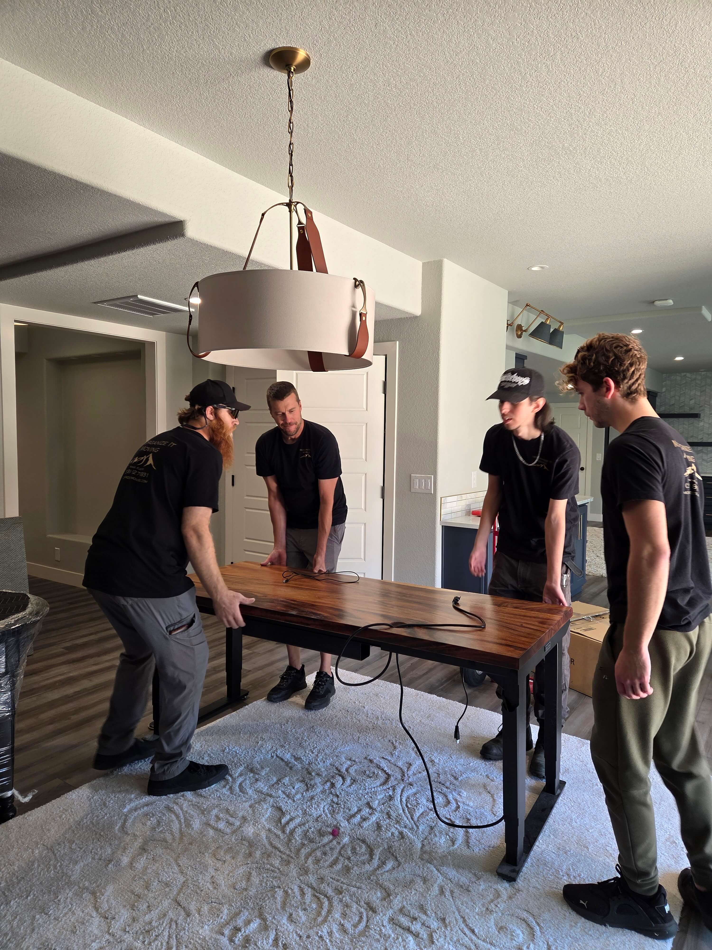 Photo of moving team discussing the move of a desk