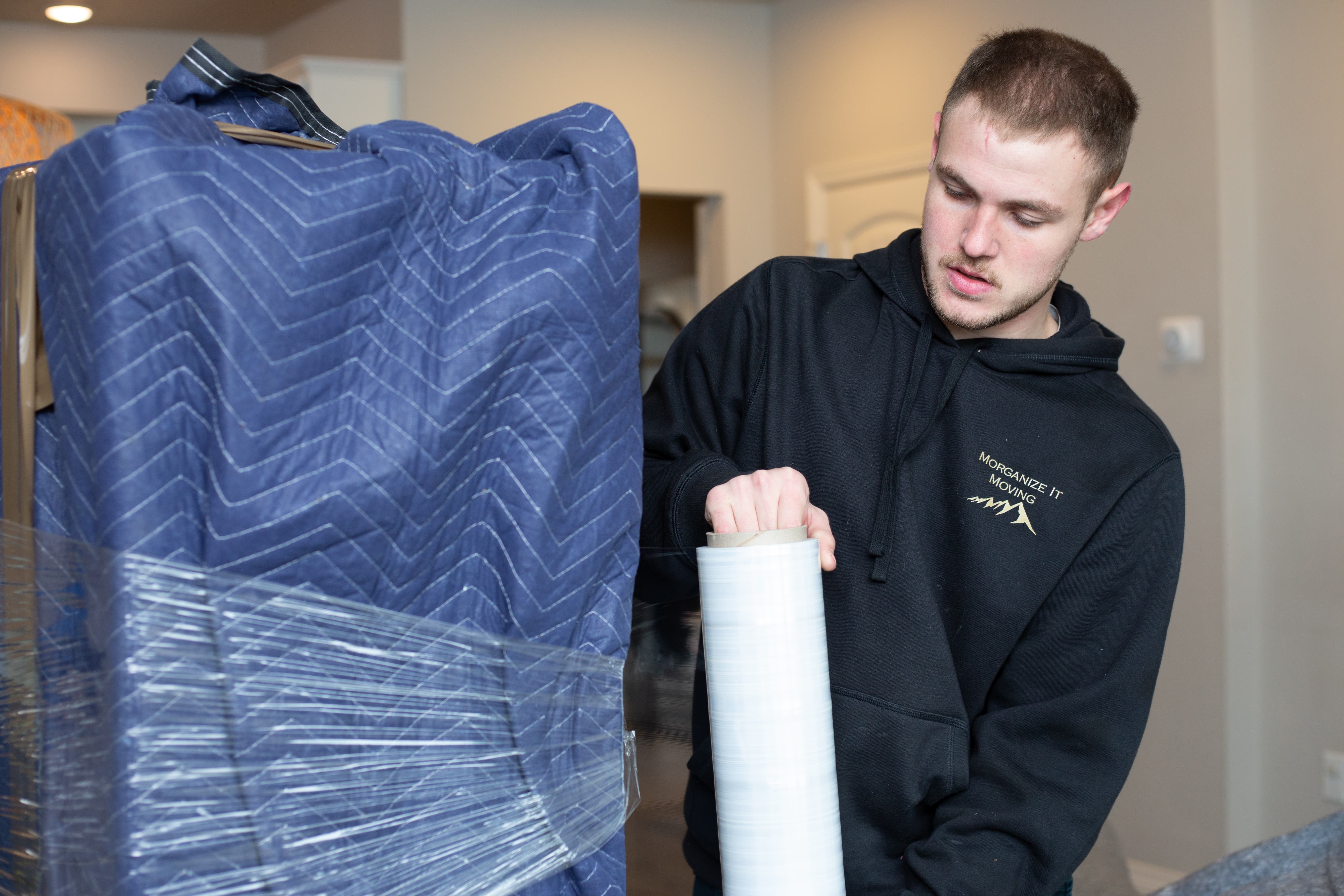 Photo of moving team discussing the move of a desk