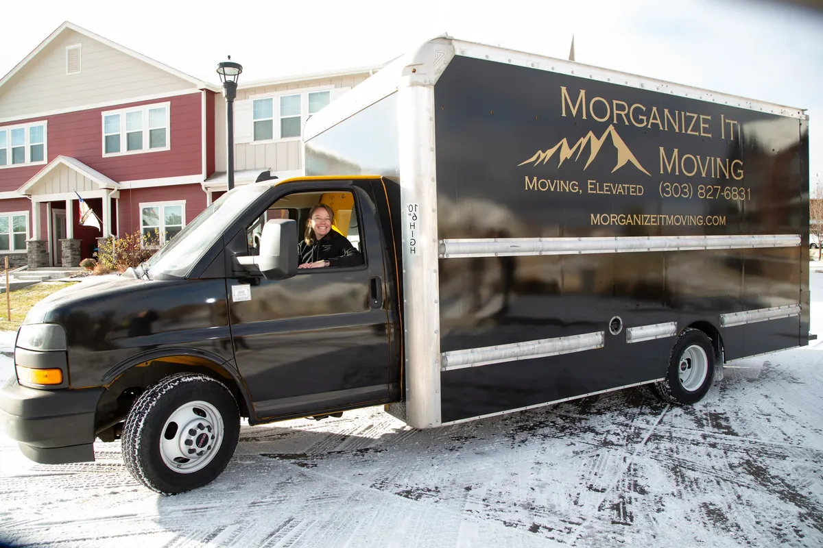 Photo of Morgan the owner driving the moving truck