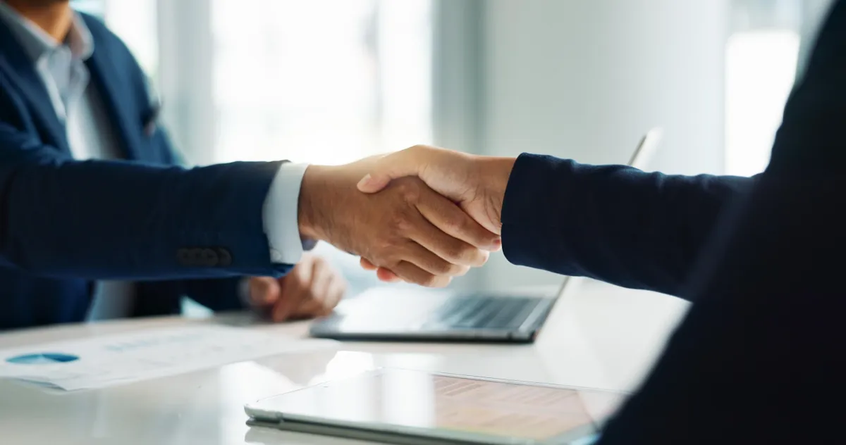 two people shaking hands