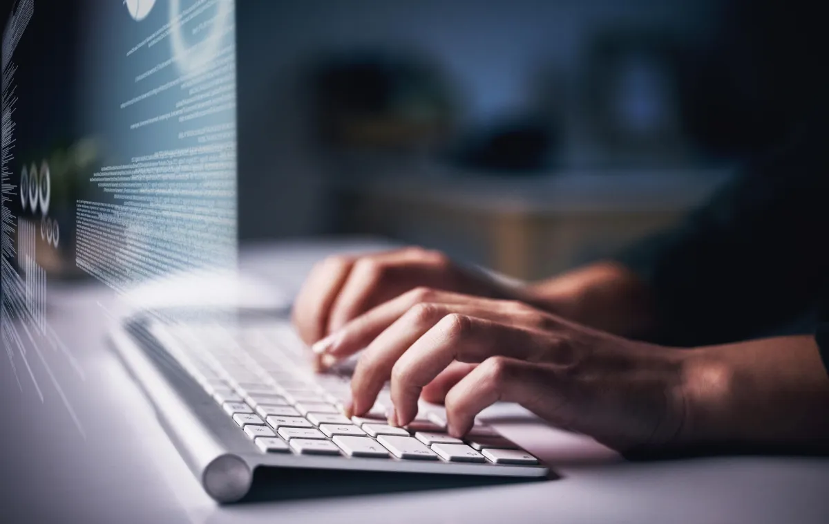 man typing on keyboard