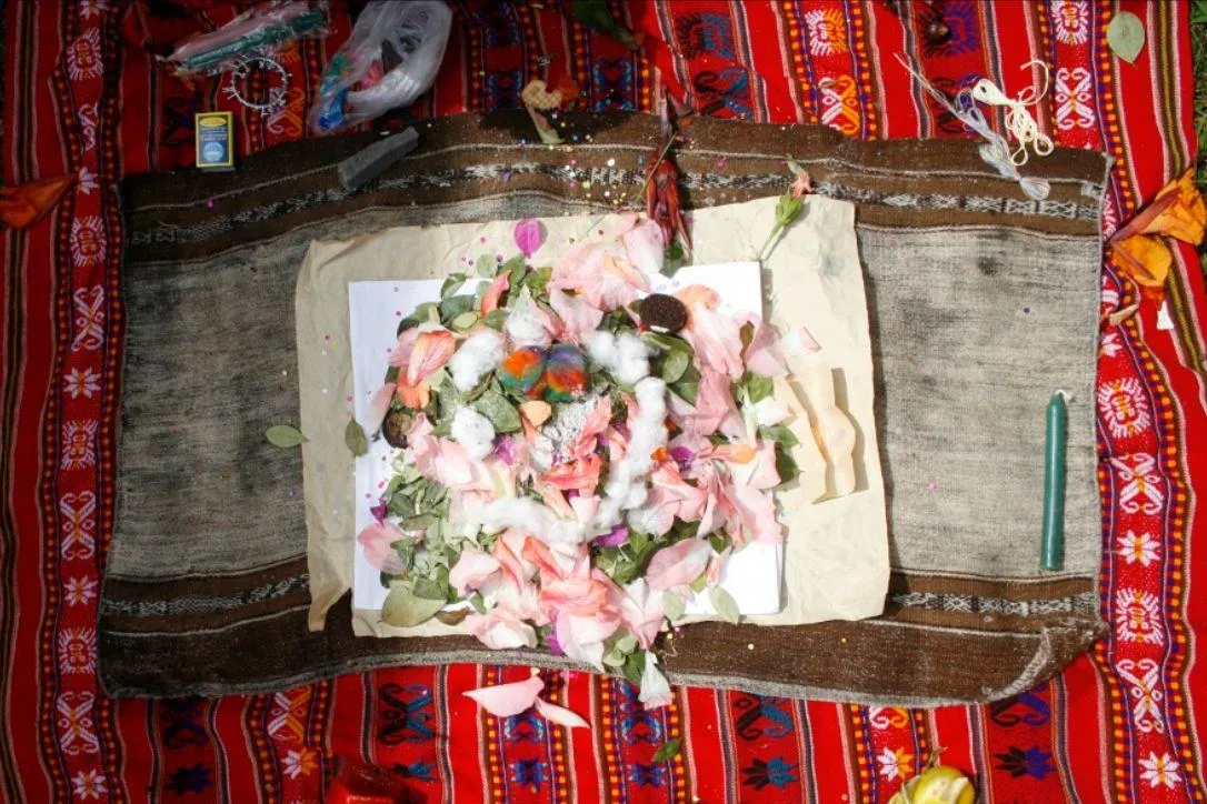 man standing on rock formation under cloudy sky during daytime