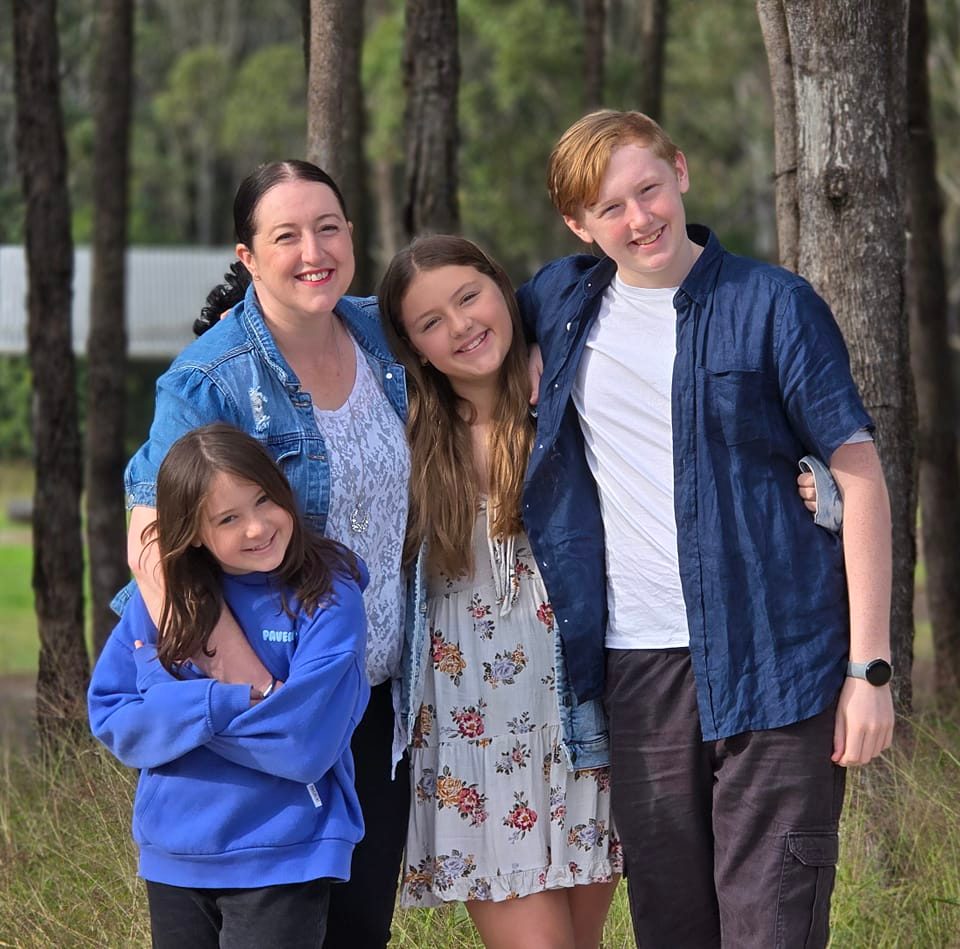 Kelly Adams smiling with her children, reflecting a deliberately designed life