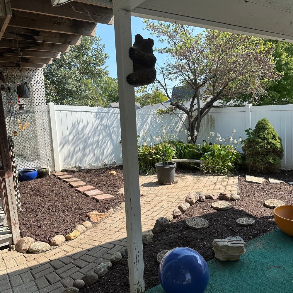 Paver patio mulching and landscaping installation in Kalona Iowa