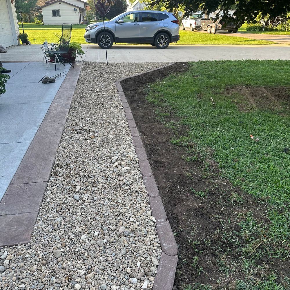 Rock landscaping and edging installation in Tiffin Iowa