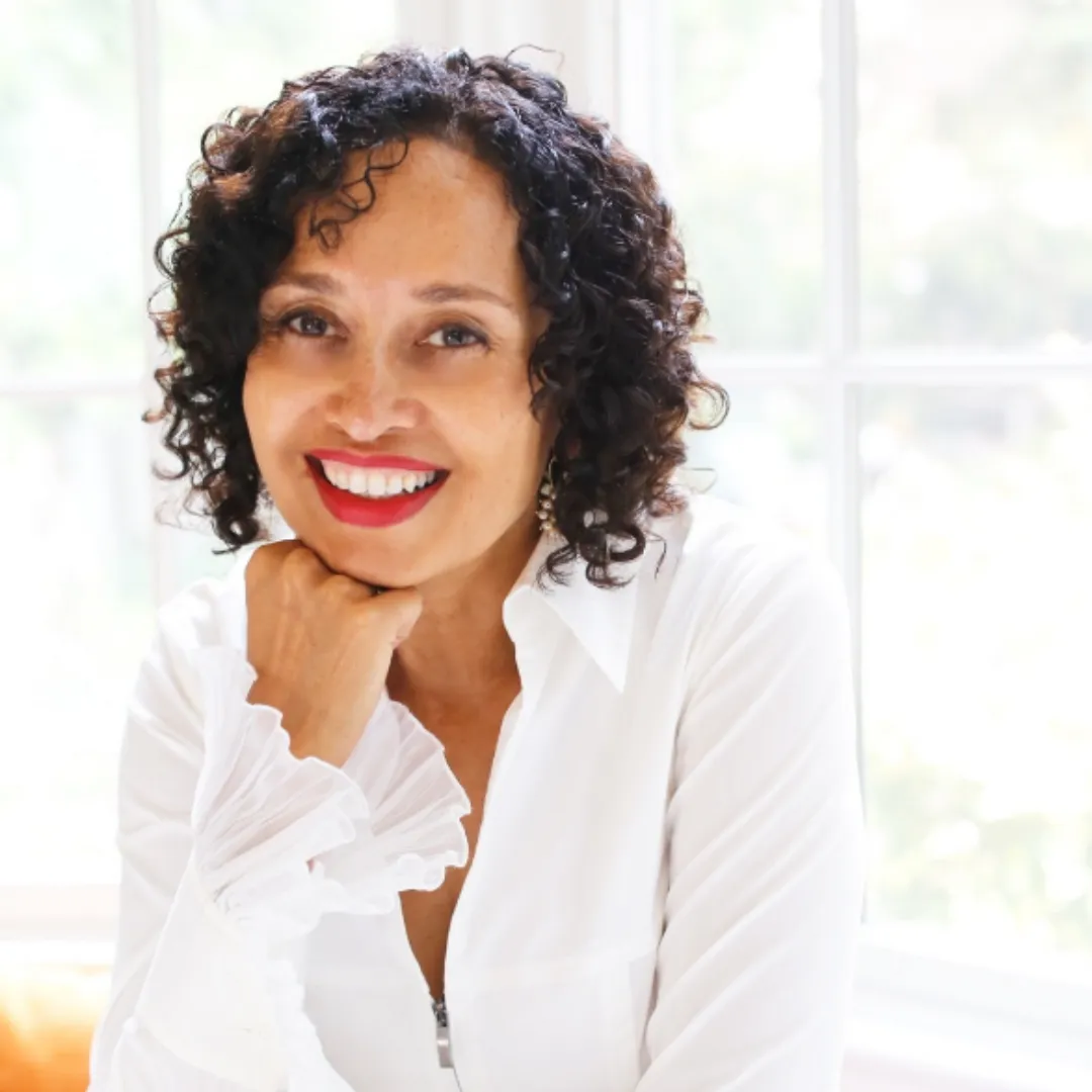 Empowered executive woman reclaiming her identity through RAMS By Baz—smiling with renewed confidence after escaping burnout and self-sacrifice.
