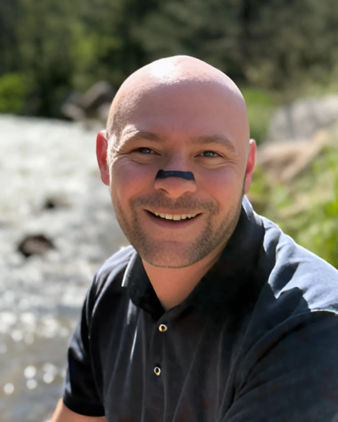 Baz Porter, leadership authority and creator of the Sovereign Leadership framework, photographed outdoors in natural light, representing calm decision-making, emotional mastery, and embodied executive presence.