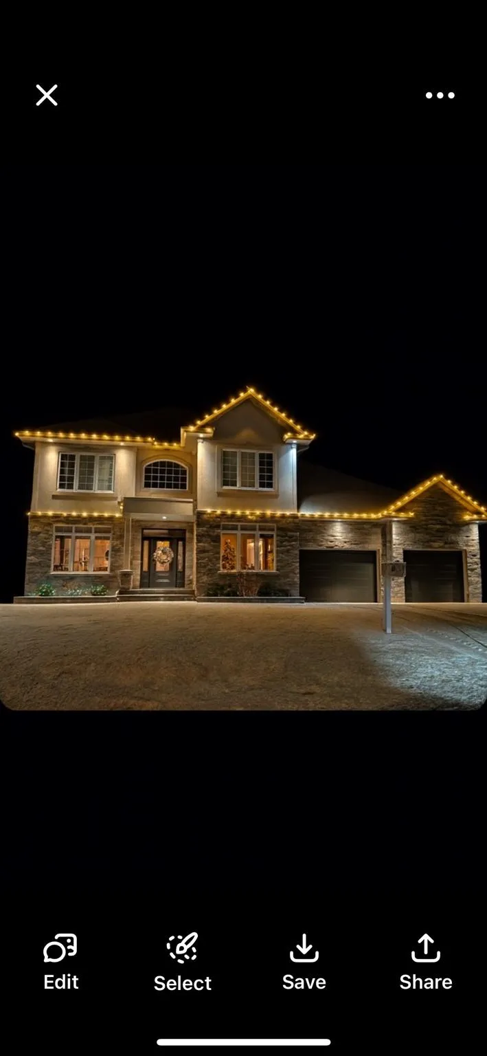 Warm-white C9 Christmas lights following the roofline of a two-storey home