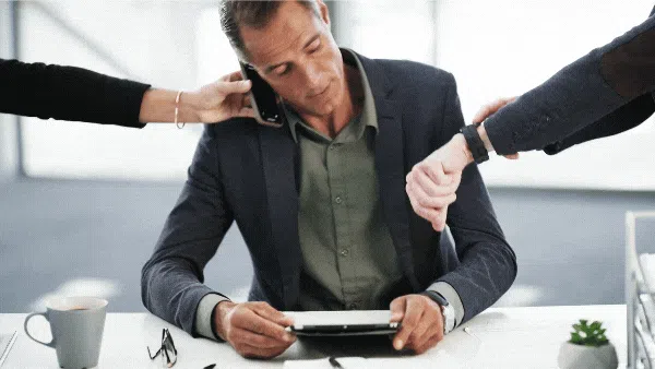 GIF of a business owner who's overwhelmed with managing his business.