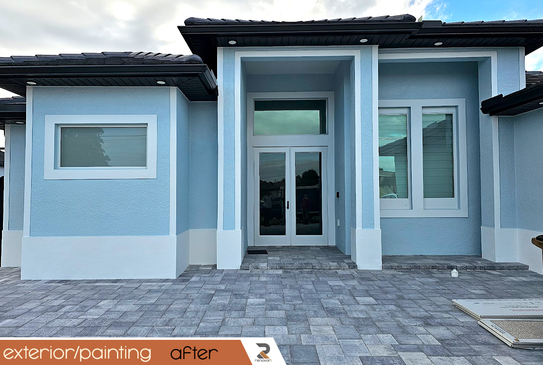 a tall building with a crane on top of it