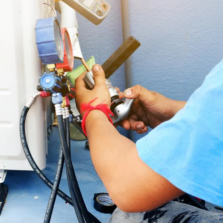 Technicians Checking Air Conditioner