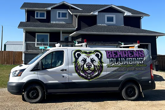 Plumbing van in front of residential home.