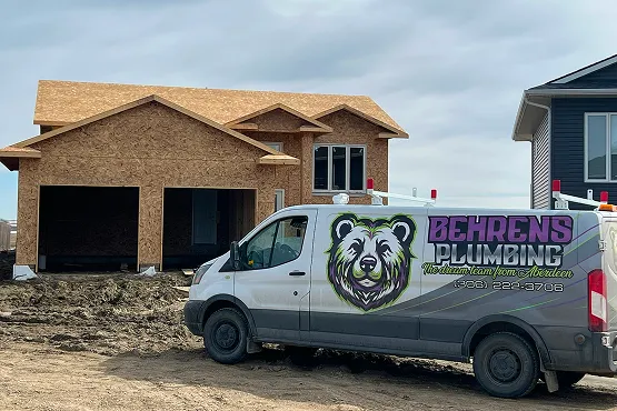 Plumbing van in front of residential home.