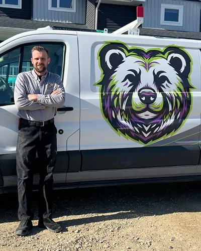 Crew in front of plumbing van
