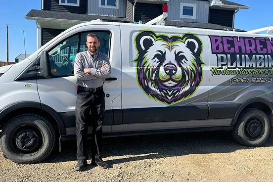Plumbing van in front of residential home.