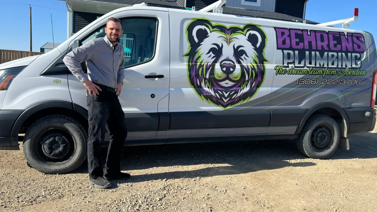 Crew in front of plumbing van