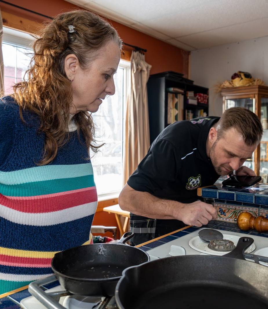 Plumber in front of van.