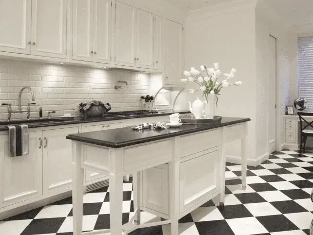 Modern Richmond kitchen with white cabinets, quartz countertops, stainless appliances, hardwood floors, and natural light.