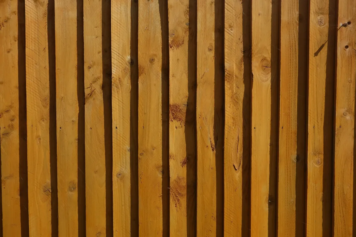 Picture of fence installers installing wood privacy fence.