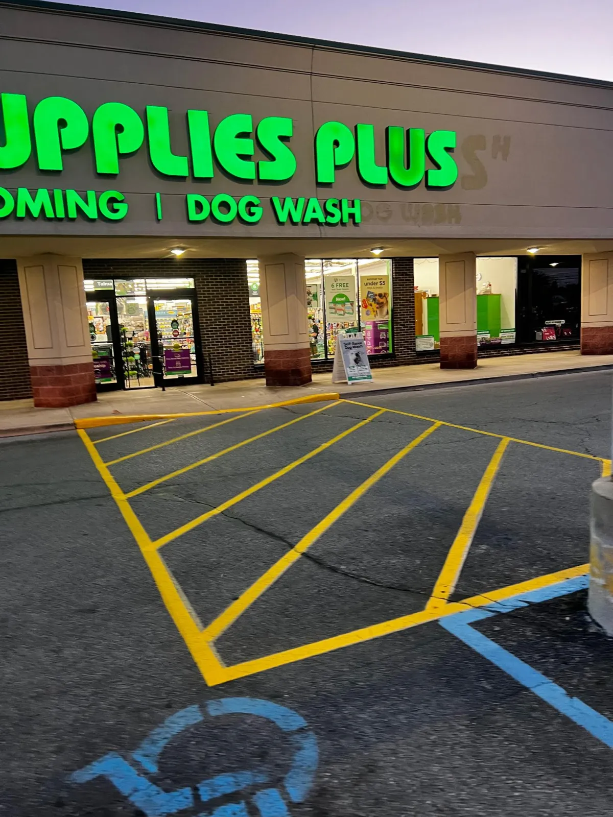 Fresh yellow parking lot line striping applied by Sommer’s Sealcoating in Toledo, Ohio – professional pavement marking services.