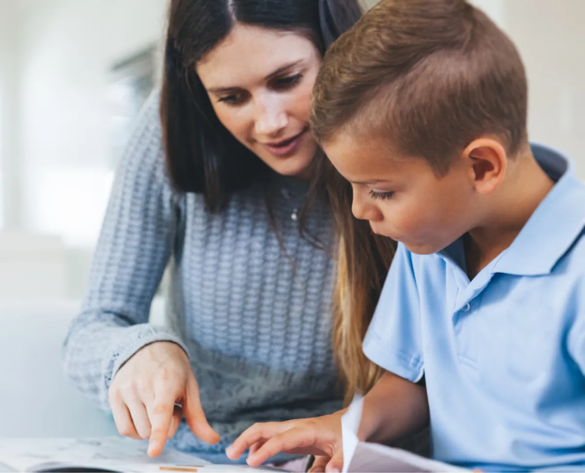 Mom tutoring her son