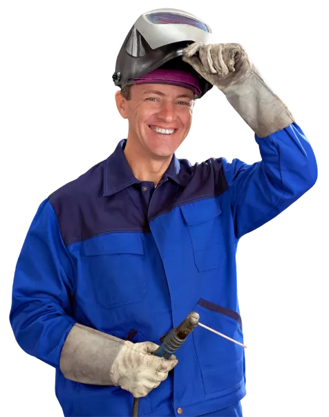 Smiling welder in blue uniform lifting his helmet while holding a welding rod.