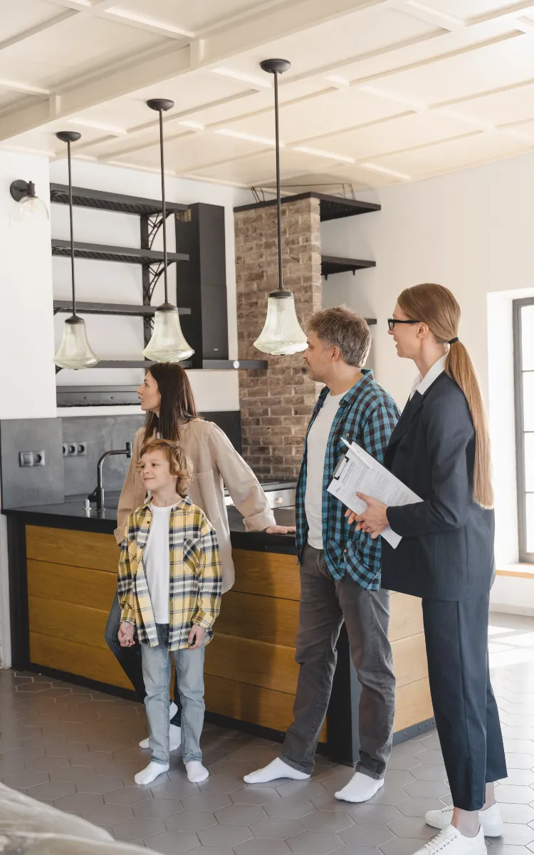Photo of family with REALTOR viewing a home