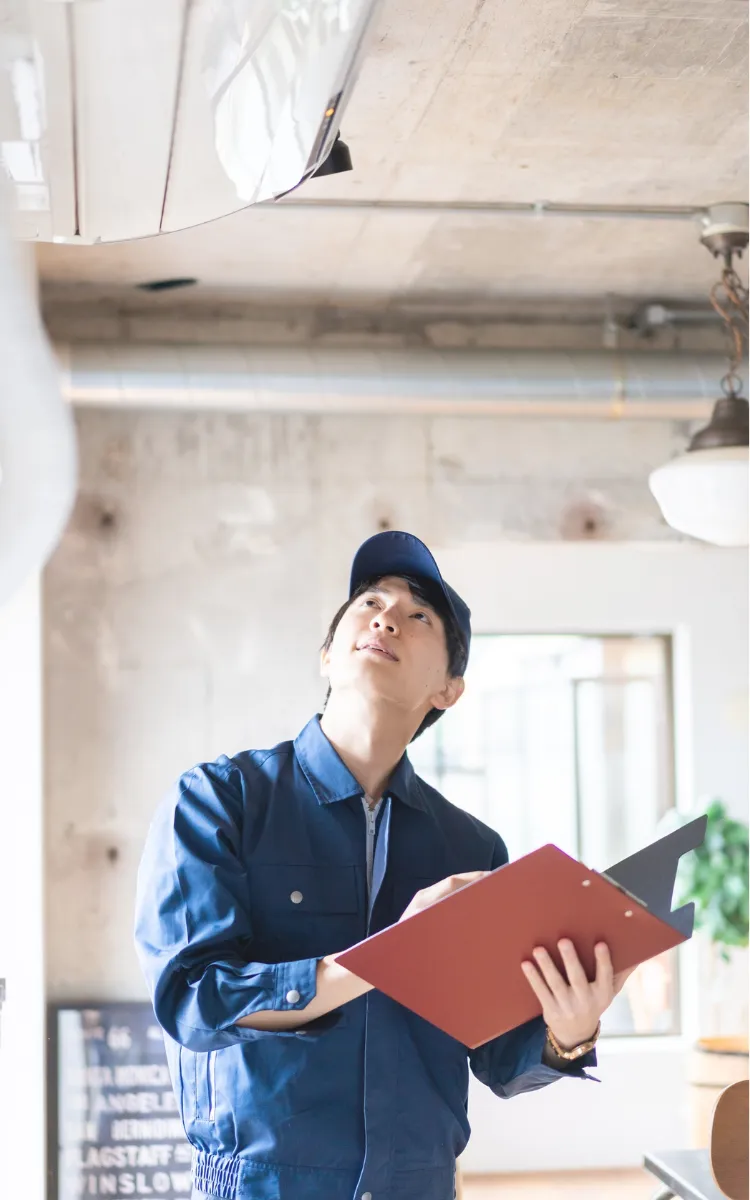 Photo of man inspecting home
