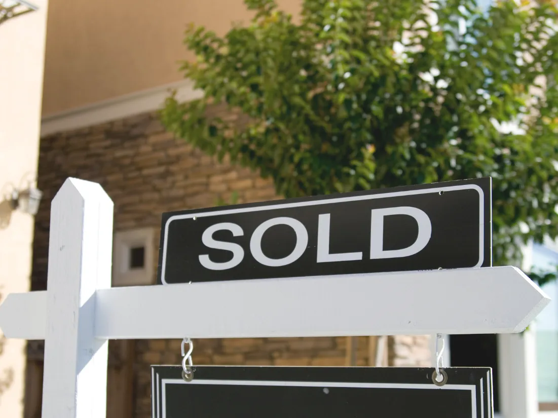 photo of a sold sign real estate