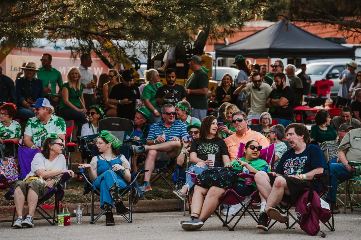 Live band performing on stage at Downtown Wichita Falls St. Patrick’s Day festival with crowd gathered.