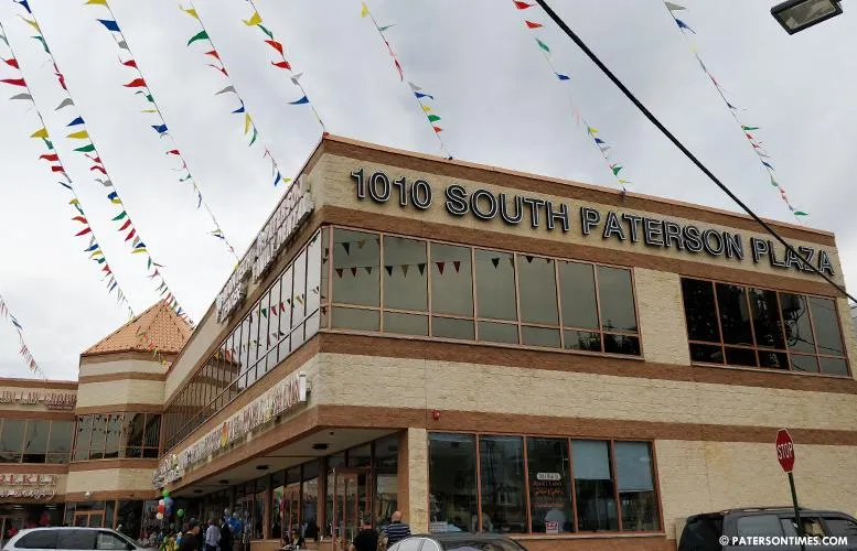 compact backyard deck with stairs and railing in South Paterson NJ