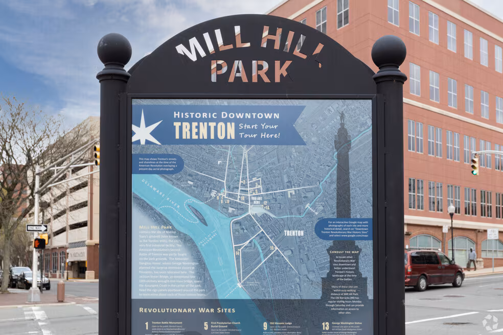 raised wood deck with classic railing behind brick home in Mill Hill Trenton NJ
