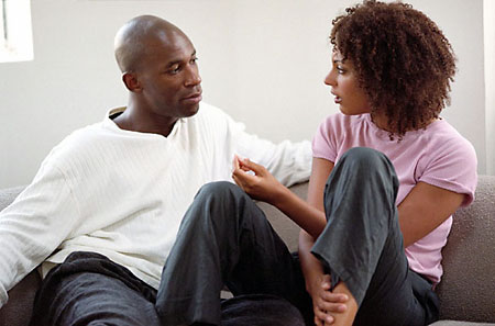 Couple working through a disagreement calmly using mindful communication