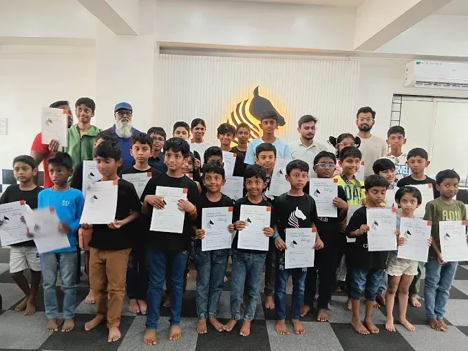Students at CHESS KLUB with certificate on a Stage