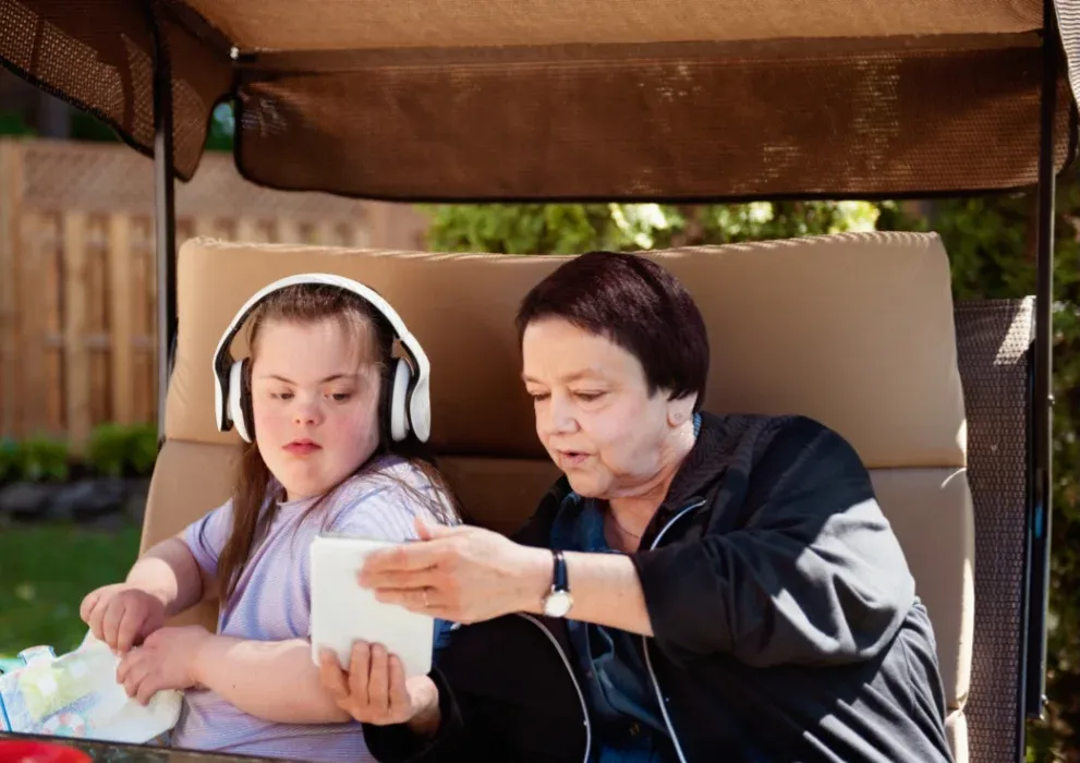 grayscale photography of man holding syringe injecting on woman left arm