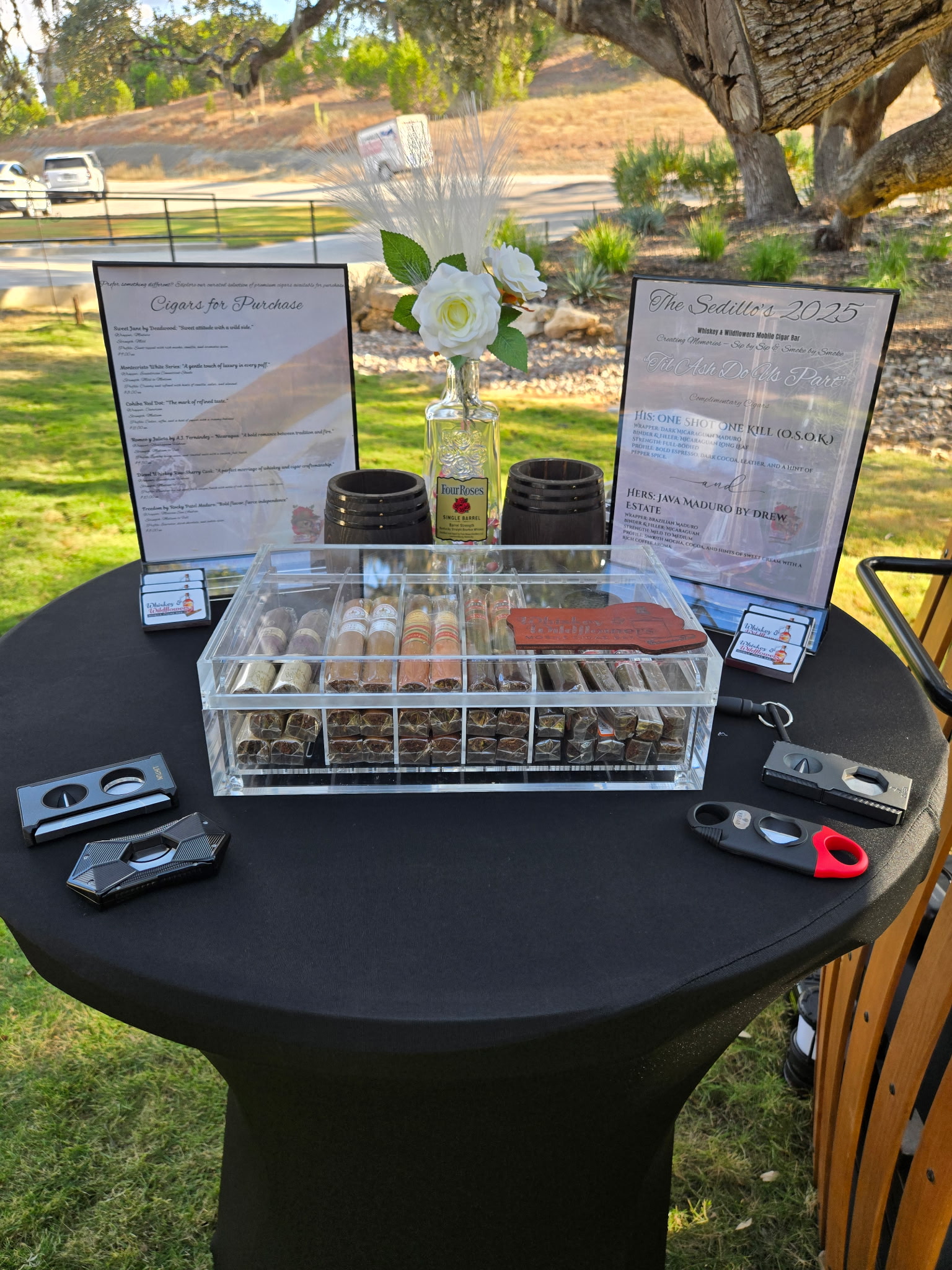 Elegant mobile cigar bar setup at a wedding reception with premium cigars, custom cigar menu, and accessories for guest enjoyment.