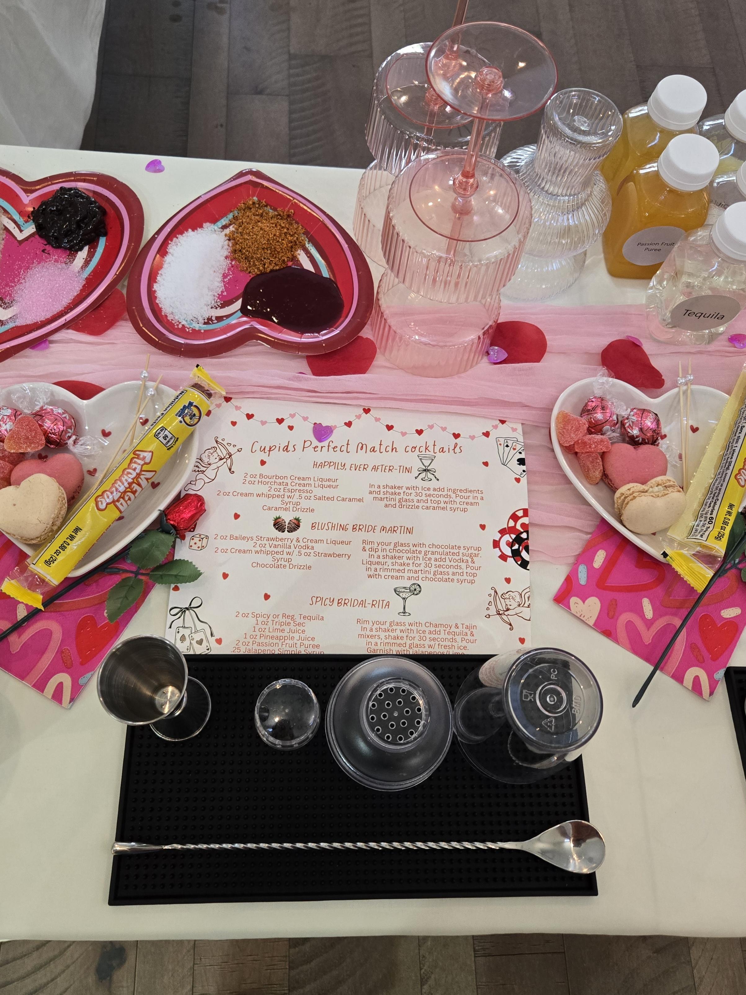 Printed cocktail recipe card and mini bottles arranged at a bachelorette mixology station