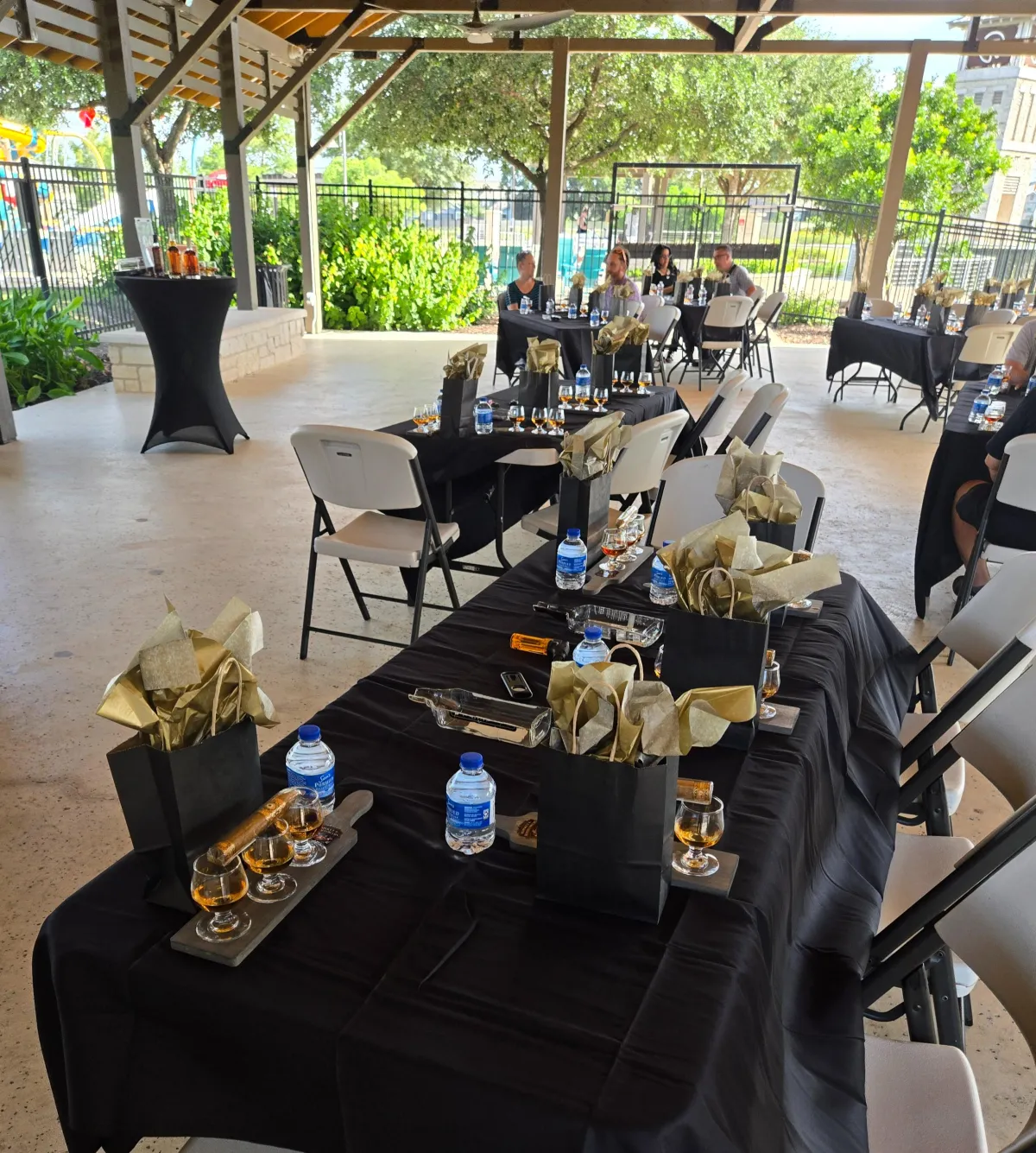 Individual whiskey and cigar pairing place settings at a seated corporate tasting event