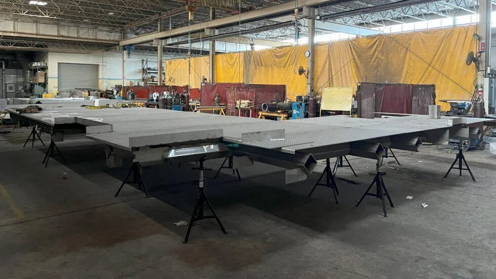 Large pre-assembled platform sections showcasing vertical integration for fast installation